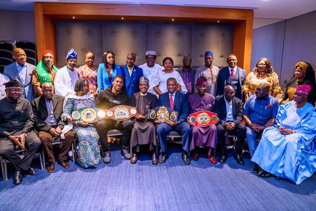 Anthony Joshua presents belts to Buhari 